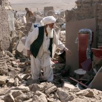 A man cleans up after an earthquake in Zenda Jan district in Herat province, Afghanistan, on Oct. 8, 2023.